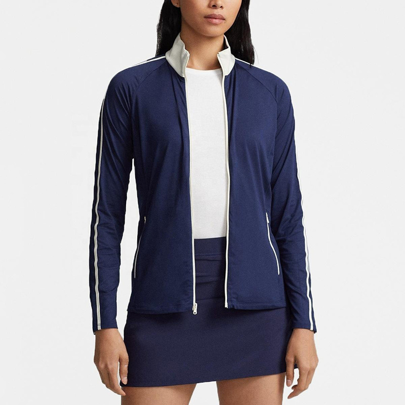 Women wearing lightweight golf jackets on golf course in Australia Women wearing lightweight golf jackets on golf course in Australia